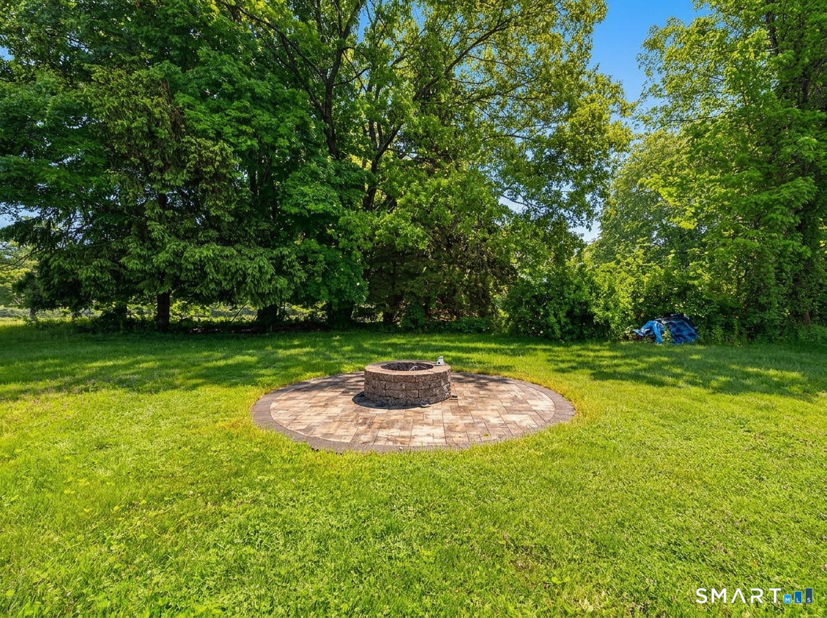 235 Scotland Road Norwich, CT 06360 - Photo 28 of 31 a backyard of a house with lots of green space
