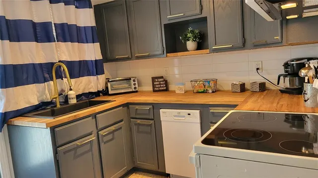 a kitchen with a sink and cabinets