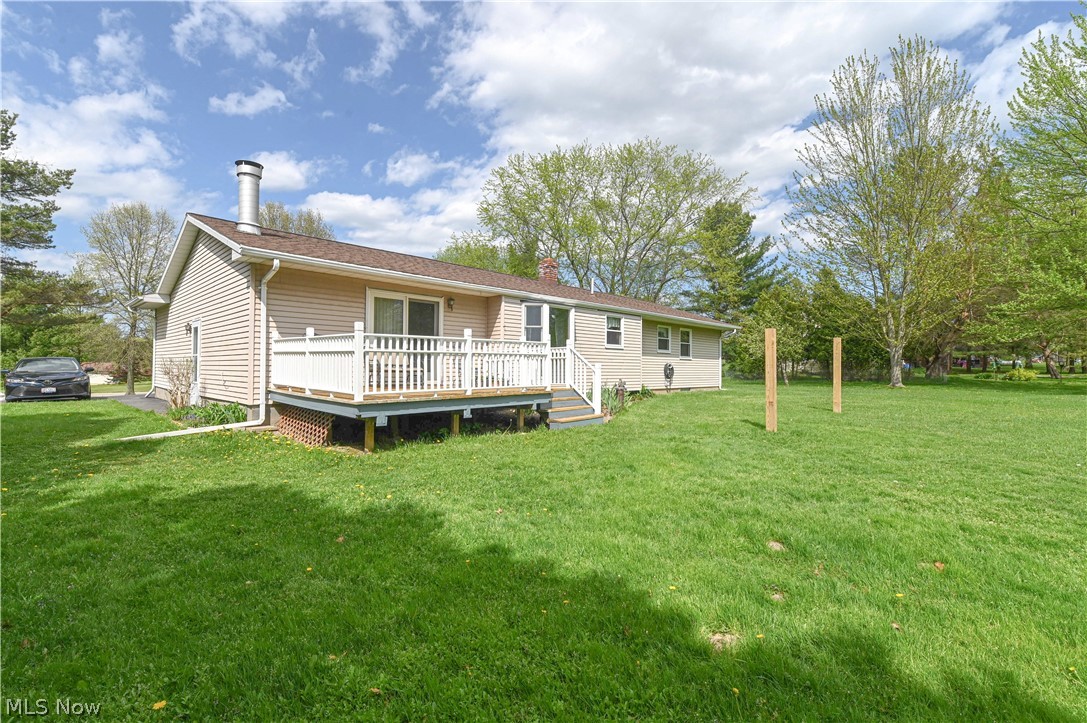 13425 Chardon-Windsor Road Chardon, OH 44024 - Photo 46 of 50 Rear view of property with a deck and a lawn