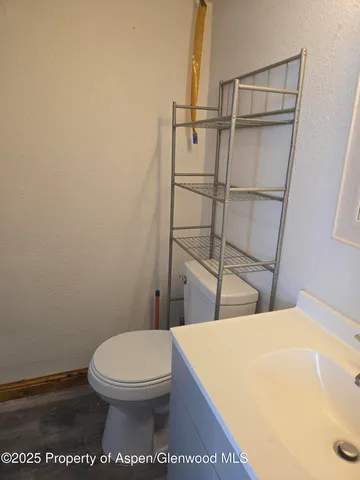 a bathroom with a toilet and a sink