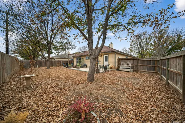 a view of house with a yard