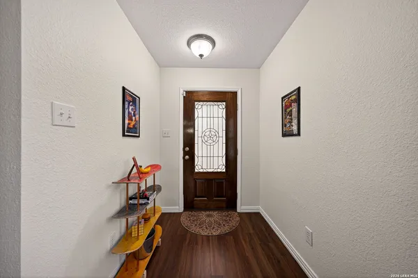 a view of room with window and wooden floor