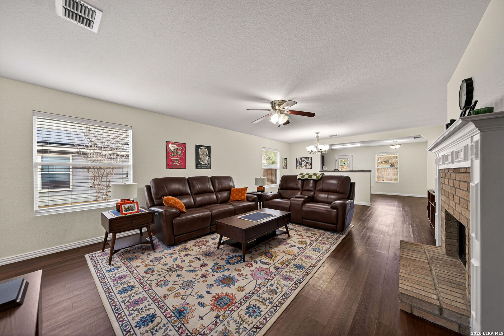 7942 Ruidoso Chase Selma, TX 78154 - Photo 8 of 26 a living room with furniture and a fireplace