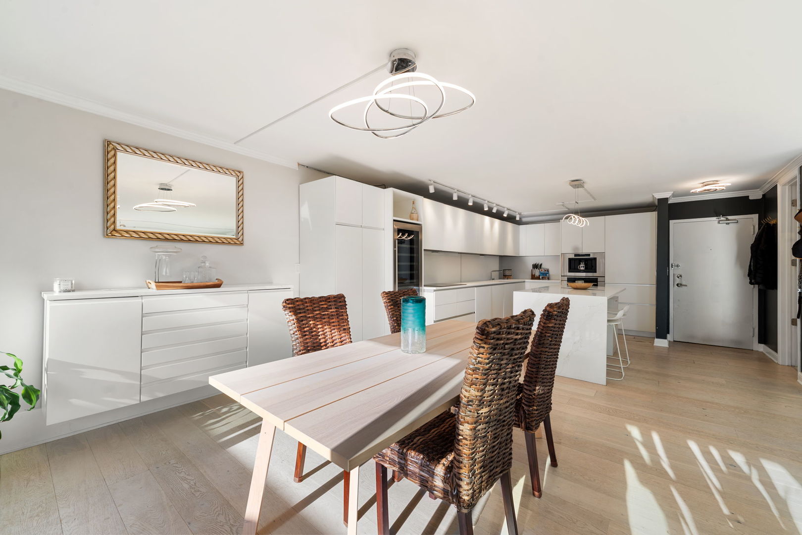 1516 North State Parkway, Unit 5D Chicago, IL 60610 - Photo 5 of 34 a kitchen with a table chairs refrigerator and microwave