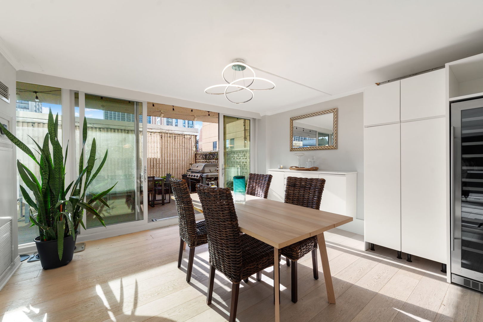 1516 North State Parkway, Unit 5D Chicago, IL 60610 - Photo 6 of 34 a view of a dining room with furniture window and wooden floor