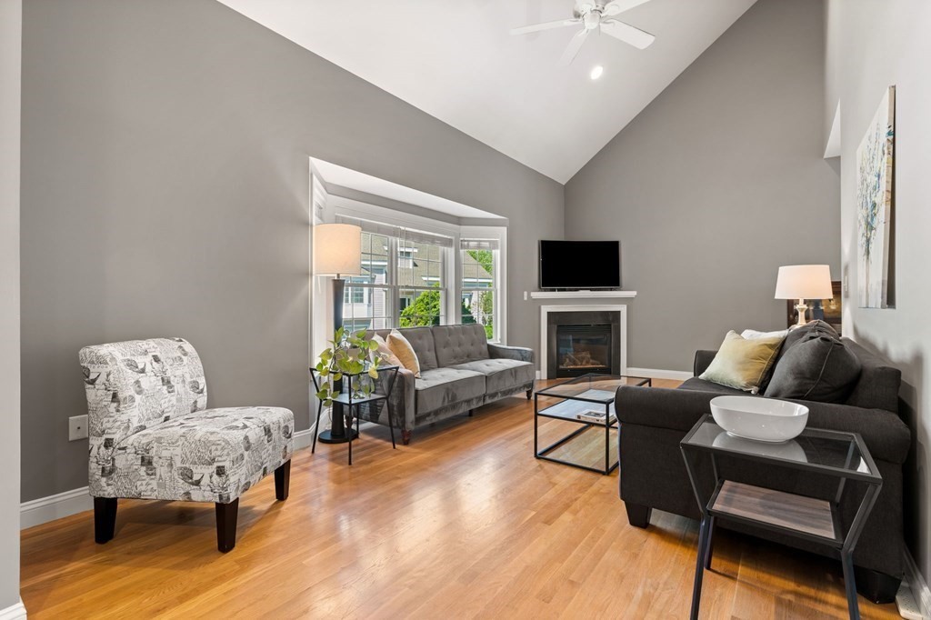 2 Hannah Dodge Road, Unit A Littleton, MA 01460 - Photo 11 of 28 a living room with furniture and a flat screen tv