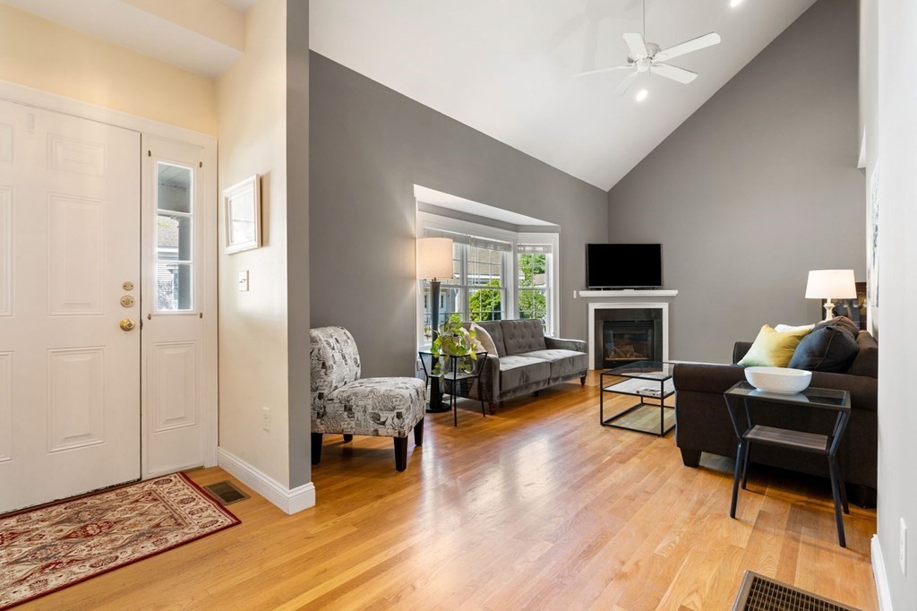 2 Hannah Dodge Road, Unit A Littleton, MA 01460 - Photo 12 of 28 a living room with furniture and a fireplace