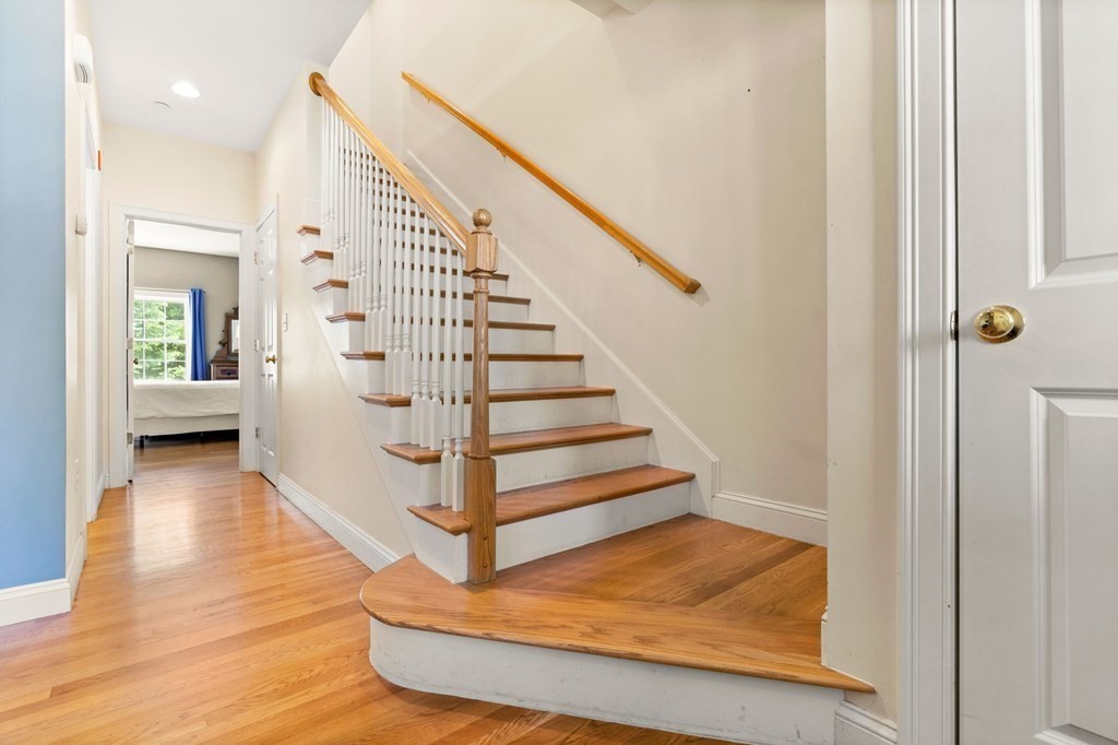 2 Hannah Dodge Road, Unit A Littleton, MA 01460 - Photo 16 of 28 a view of entryway and hall with wooden floor