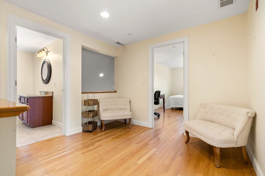 2 Hannah Dodge Road, Unit A Littleton, MA 01460 - Photo 17 of 28 a living room with furniture and a table