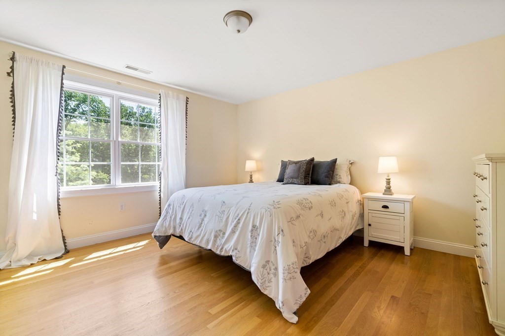 2 Hannah Dodge Road, Unit A Littleton, MA 01460 - Photo 20 of 28 a bedroom with a bed and a window