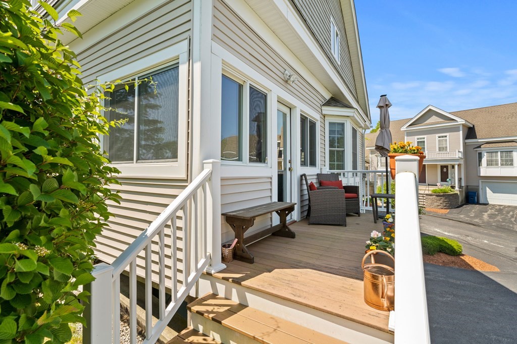 2 Hannah Dodge Road, Unit A Littleton, MA 01460 - Photo 2 of 28 a view of a house with a couches chair and wooden floor