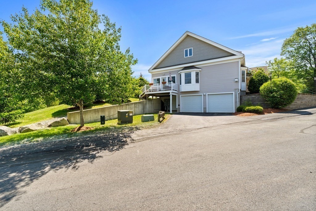 2 Hannah Dodge Road, Unit A Littleton, MA 01460 - Photo 27 of 28 a front view of a house with a yard
