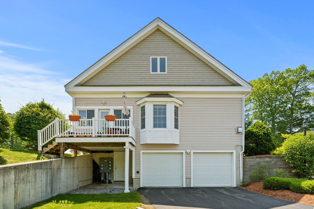 2 Hannah Dodge Road, Unit A Littleton, MA 01460 - Photo 3 of 28 a view of house and outdoor space