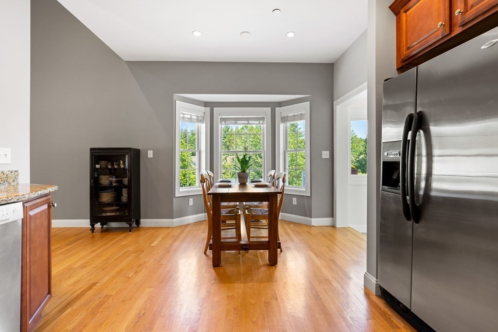 2 Hannah Dodge Road, Unit A Littleton, MA 01460 - Photo 9 of 28 a view of a livingroom with furniture window and wooden floor