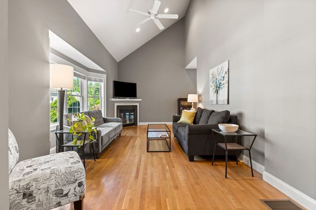 2 Hannah Dodge Road, Unit A Littleton, MA 01460 - Photo 10 of 28 a living room with furniture and a fireplace
