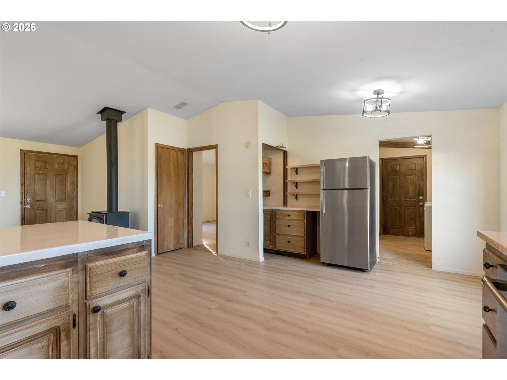 14386 Ben-Dier Road Baker City, OR 97814 - Photo 14 of 42 a kitchen with stainless steel appliances a refrigerator and a sink
