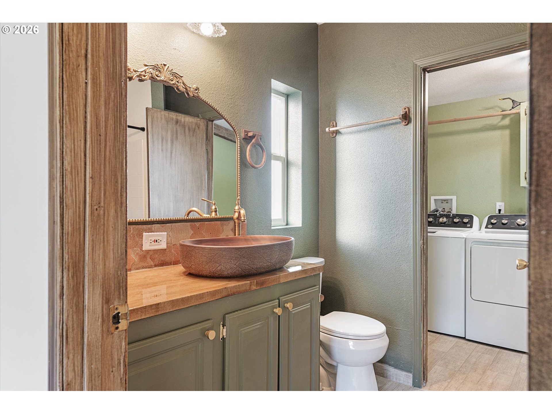 14386 Ben-Dier Road Baker City, OR 97814 - Photo 23 of 42 a bathroom with a toilet sink vanity and mirror