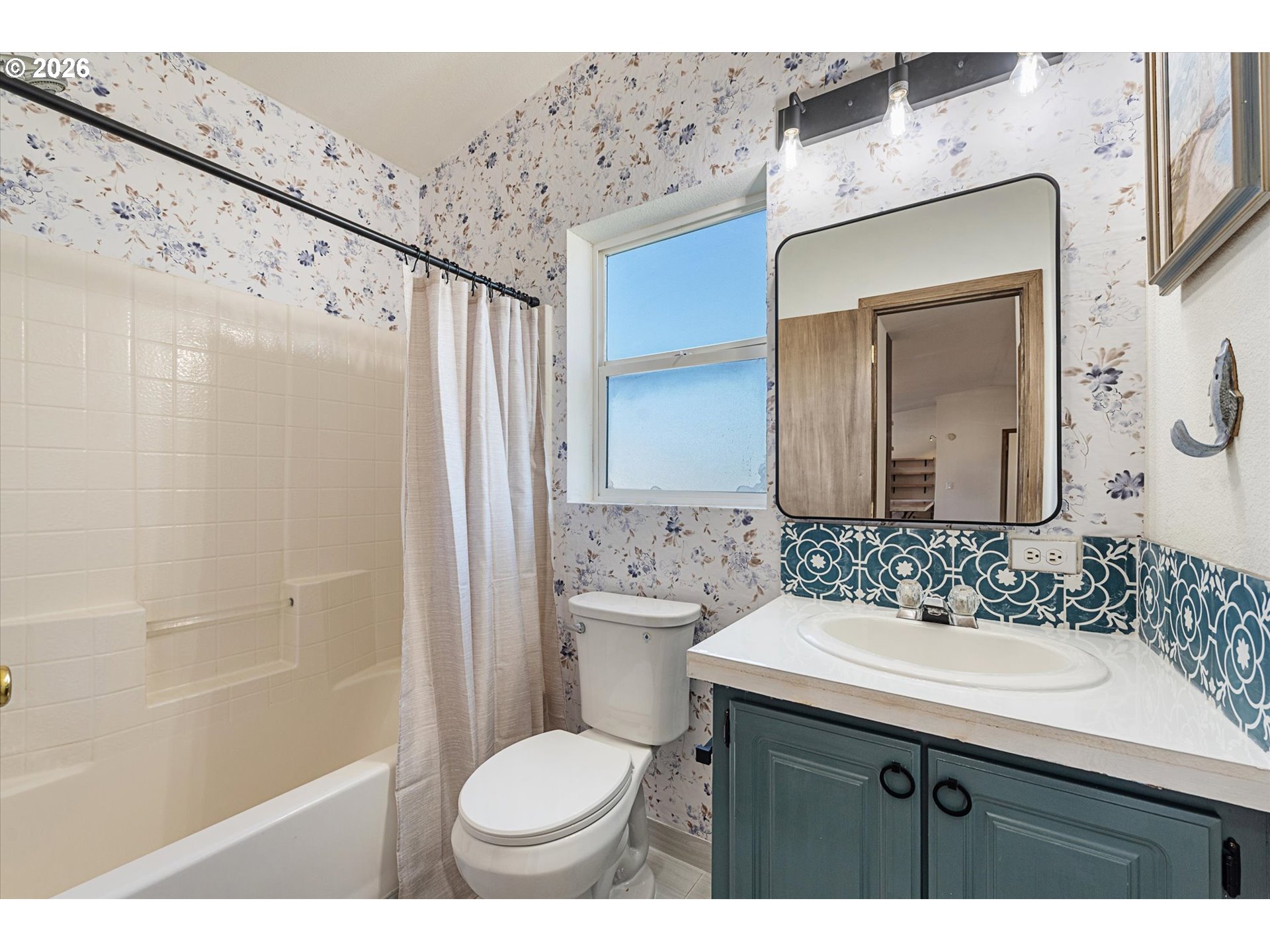 14386 Ben-Dier Road Baker City, OR 97814 - Photo 30 of 42 a bathroom with a sink and a mirror