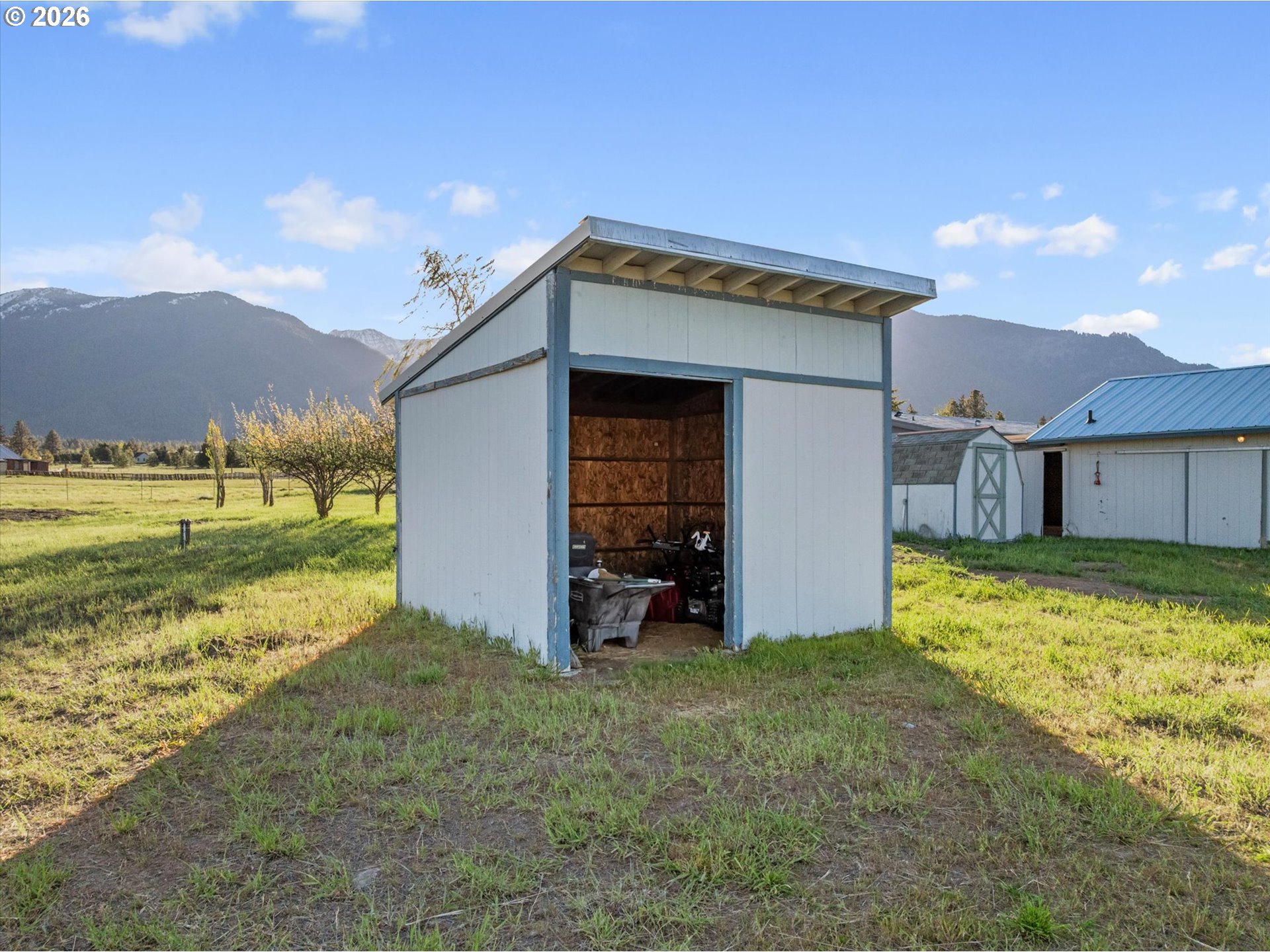 14386 Ben-Dier Road Baker City, OR 97814 - Photo 33 of 42 a view of a house with backyard and a mountain