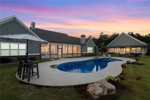 a front view of house with yard and outdoor seating
