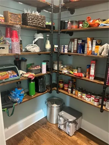 a bathroom with a tub and a view of bathroom