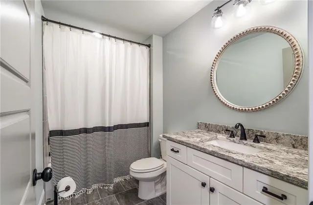 a view of a livingroom with furniture and a fireplace