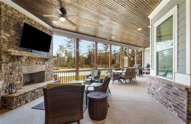 a large kitchen with kitchen island granite countertop a sink and a stove top oven with granite countertops
