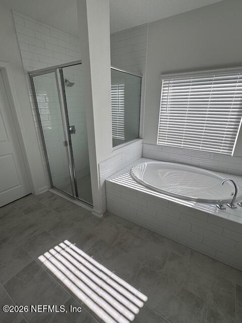 33 Chestnut Grv Road St. Augustine, FL 32092 - Photo 9 of 15 a bathroom with a bathtub and a shower