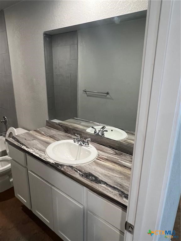 117 East Valley Road Harker Heights, TX 76548 - Photo 15 of 33 a bathroom with a granite countertop sink and a mirror