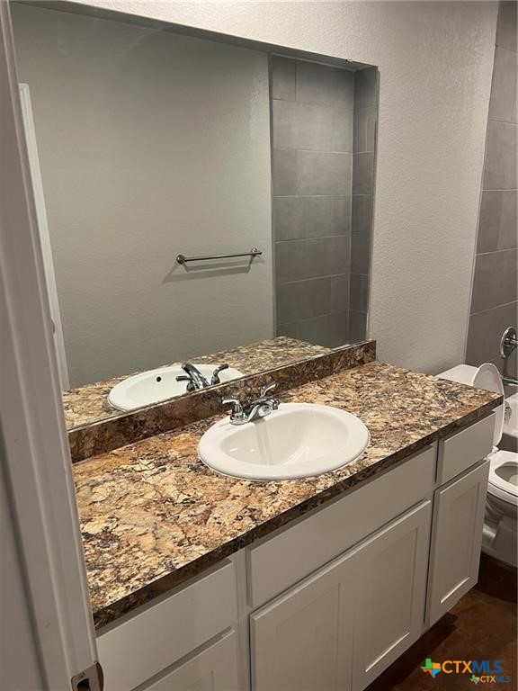 117 East Valley Road Harker Heights, TX 76548 - Photo 16 of 33 a bathroom with a granite countertop sink and a mirror