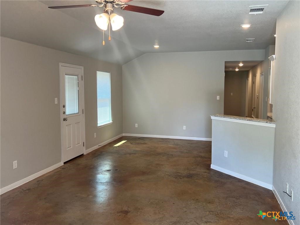 117 East Valley Road Harker Heights, TX 76548 - Photo 17 of 33 an empty room with wooden floor and windows