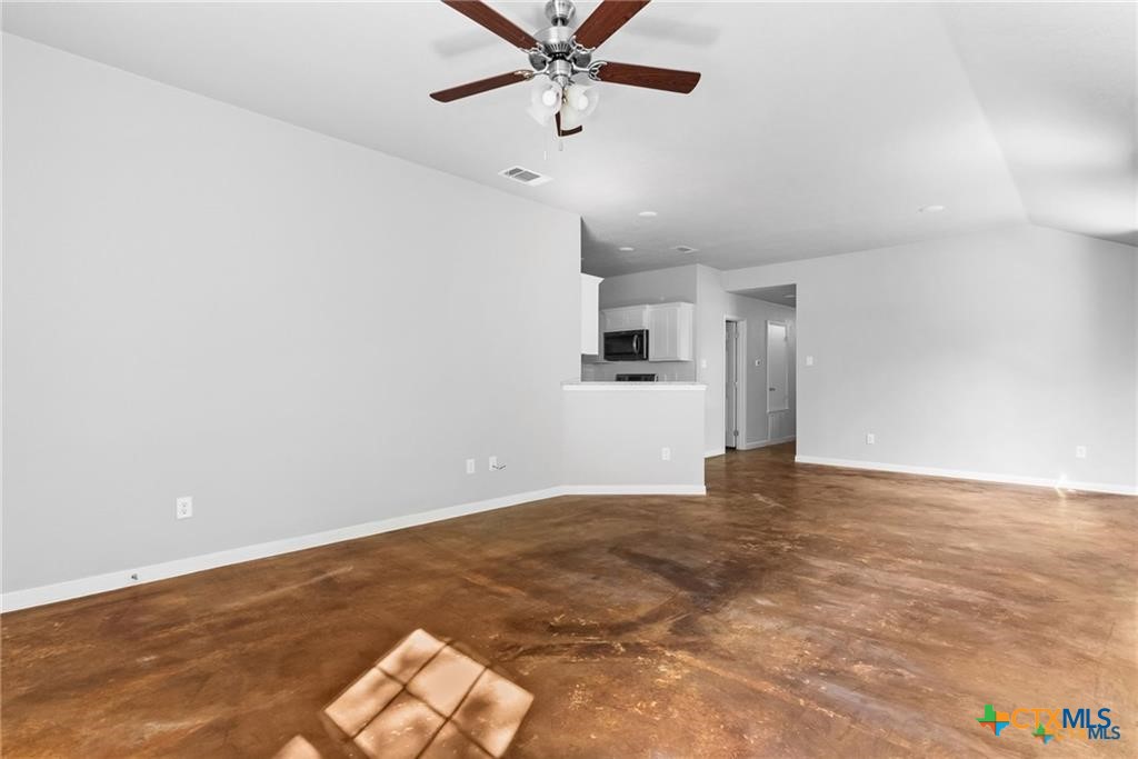 117 East Valley Road Harker Heights, TX 76548 - Photo 19 of 33 an empty room with wooden floor and ceiling fan