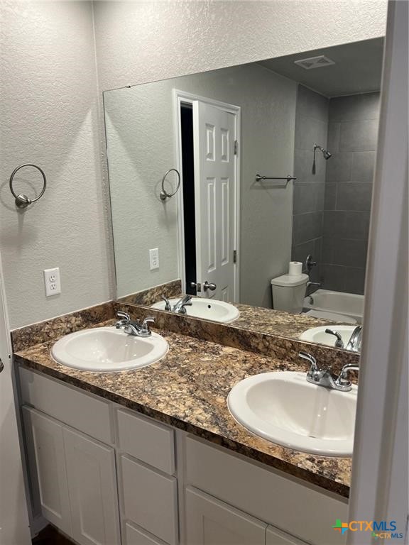 117 East Valley Road Harker Heights, TX 76548 - Photo 22 of 33 a bathroom with a granite countertop sink and a mirror
