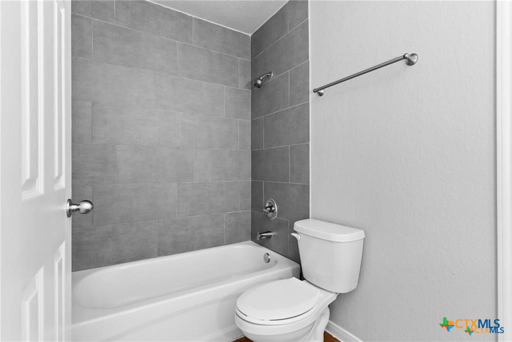 117 East Valley Road Harker Heights, TX 76548 - Photo 30 of 33 a white toilet sitting next to a bath tub