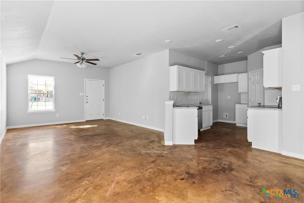 117 East Valley Road Harker Heights, TX 76548 - Photo 7 of 33 a view of a kitchen with a sink and a refrigerator