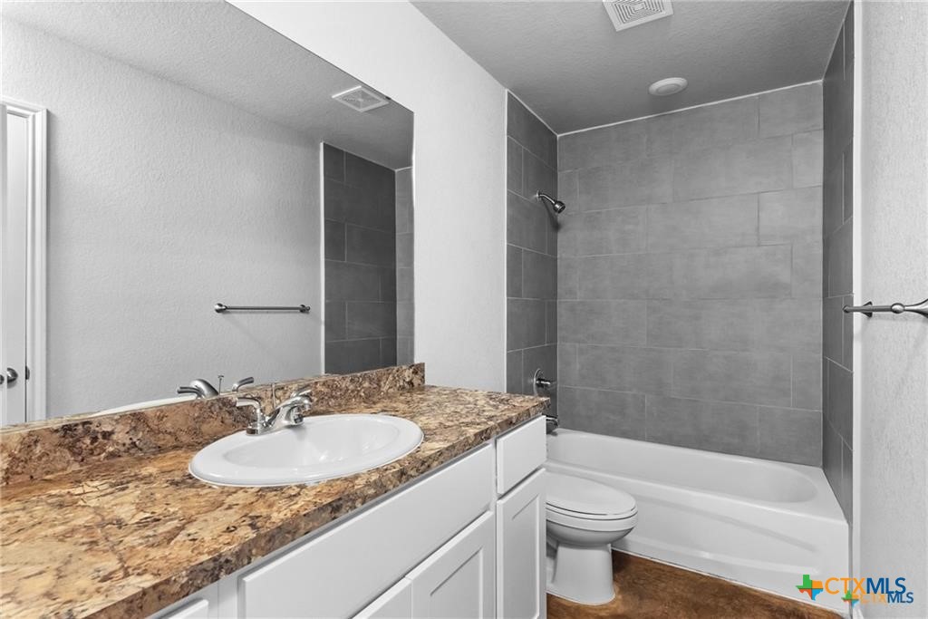 117 East Valley Road Harker Heights, TX 76548 - Photo 8 of 33 a bathroom with a granite countertop sink toilet and shower