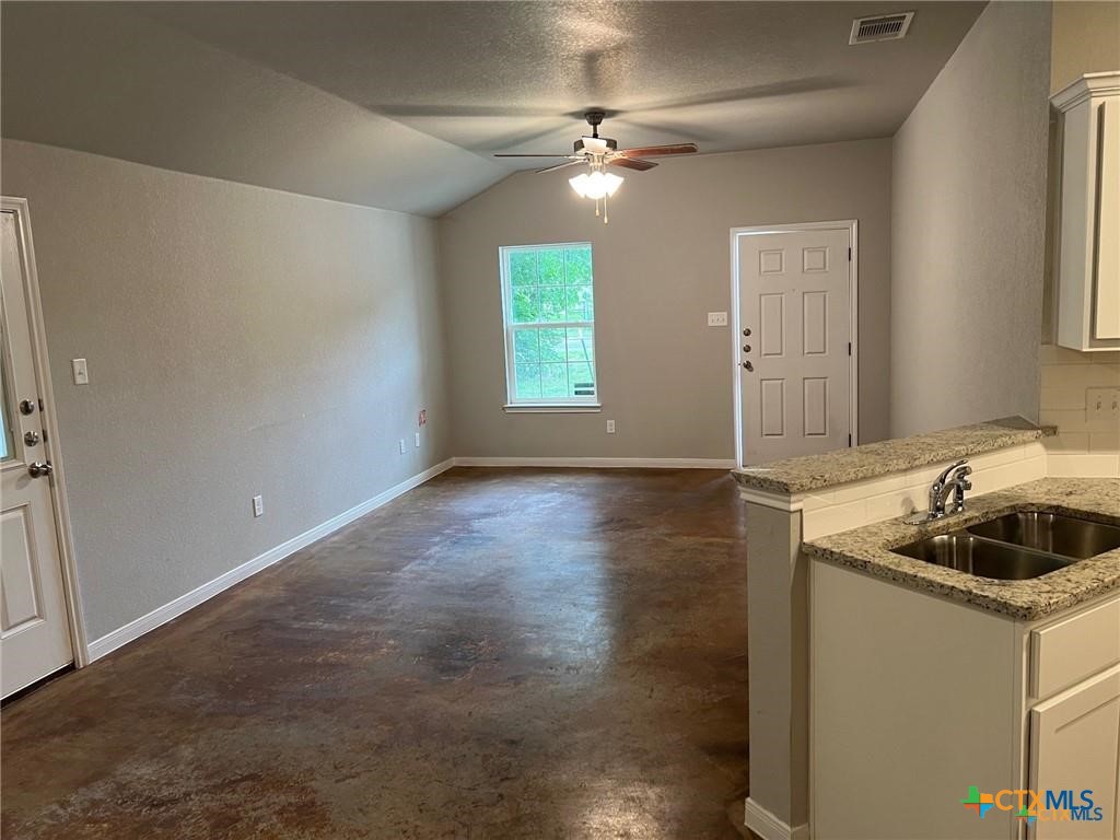 117 East Valley Road Harker Heights, TX 76548 - Photo 9 of 33 a kitchen with a sink cabinets and window