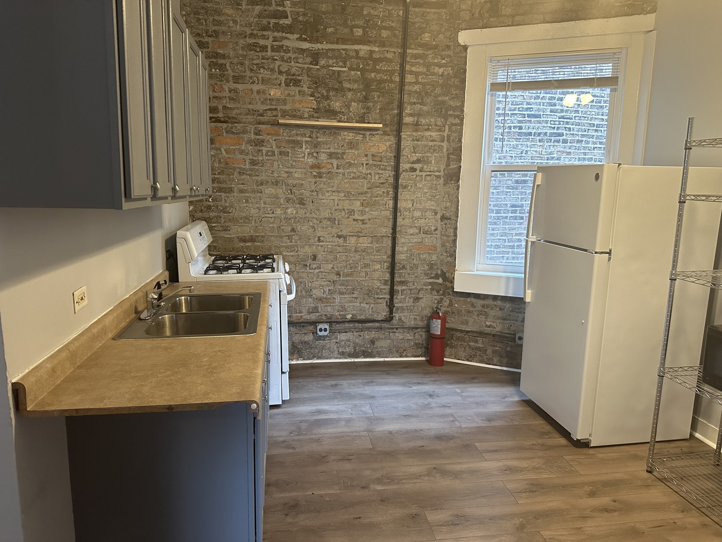 a kitchen with a refrigerator sink and stove