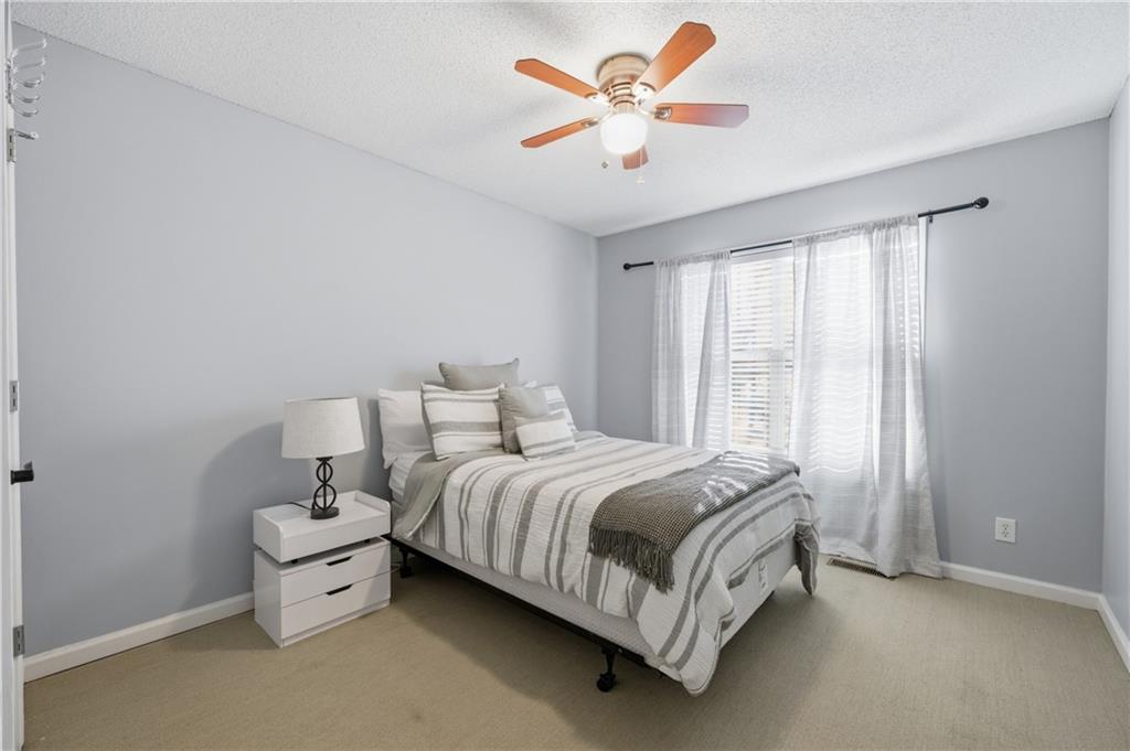 20 Miners Point Acworth, GA 30102 - Photo 13 of 21 a bed room with a bed and a chandelier