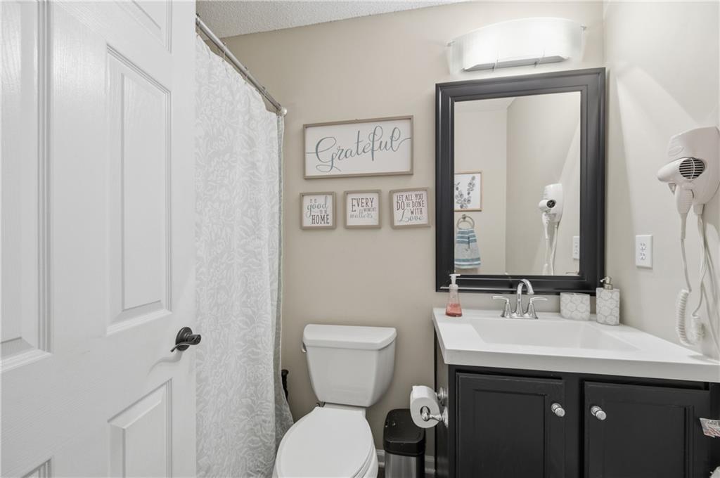 20 Miners Point Acworth, GA 30102 - Photo 14 of 21 a bathroom with a toilet sink and mirror