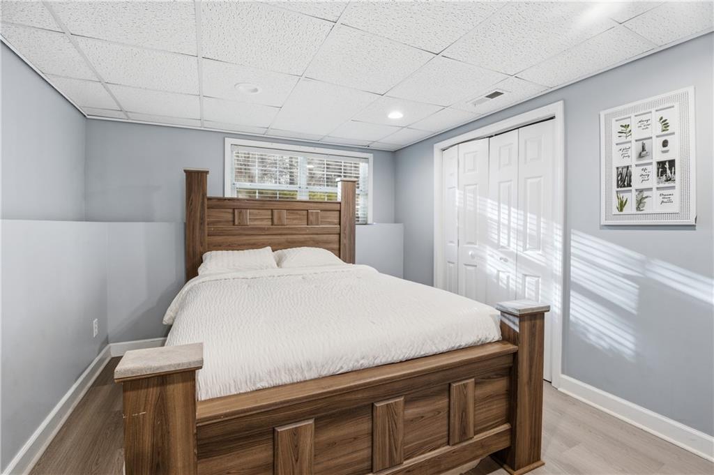 20 Miners Point Acworth, GA 30102 - Photo 16 of 21 a bed sitting in a spacious bedroom next to a window