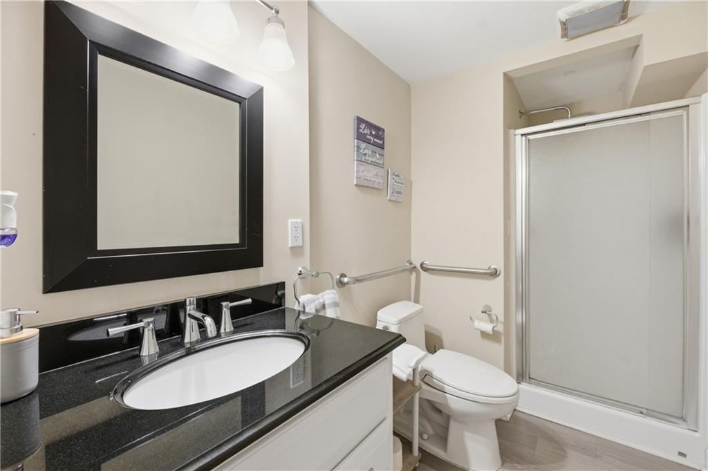 20 Miners Point Acworth, GA 30102 - Photo 19 of 21 a bathroom with a granite countertop toilet sink and mirror