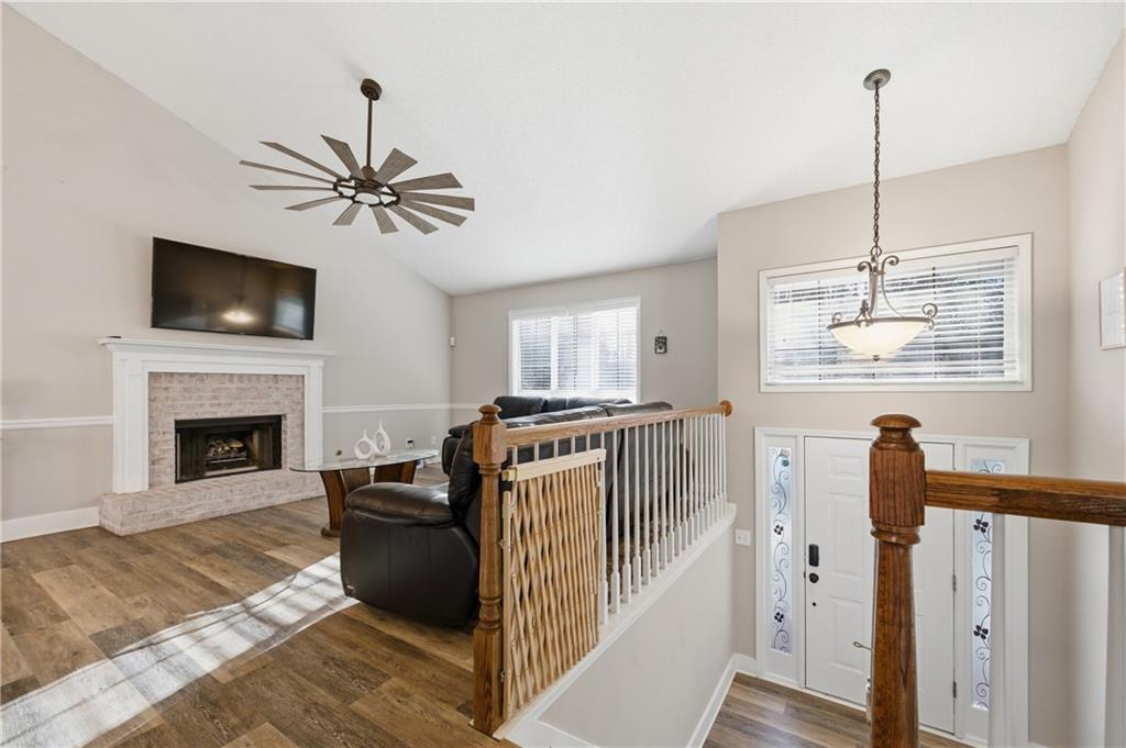 20 Miners Point Acworth, GA 30102 - Photo 3 of 21 a living room with furniture a flat screen tv and a fireplace