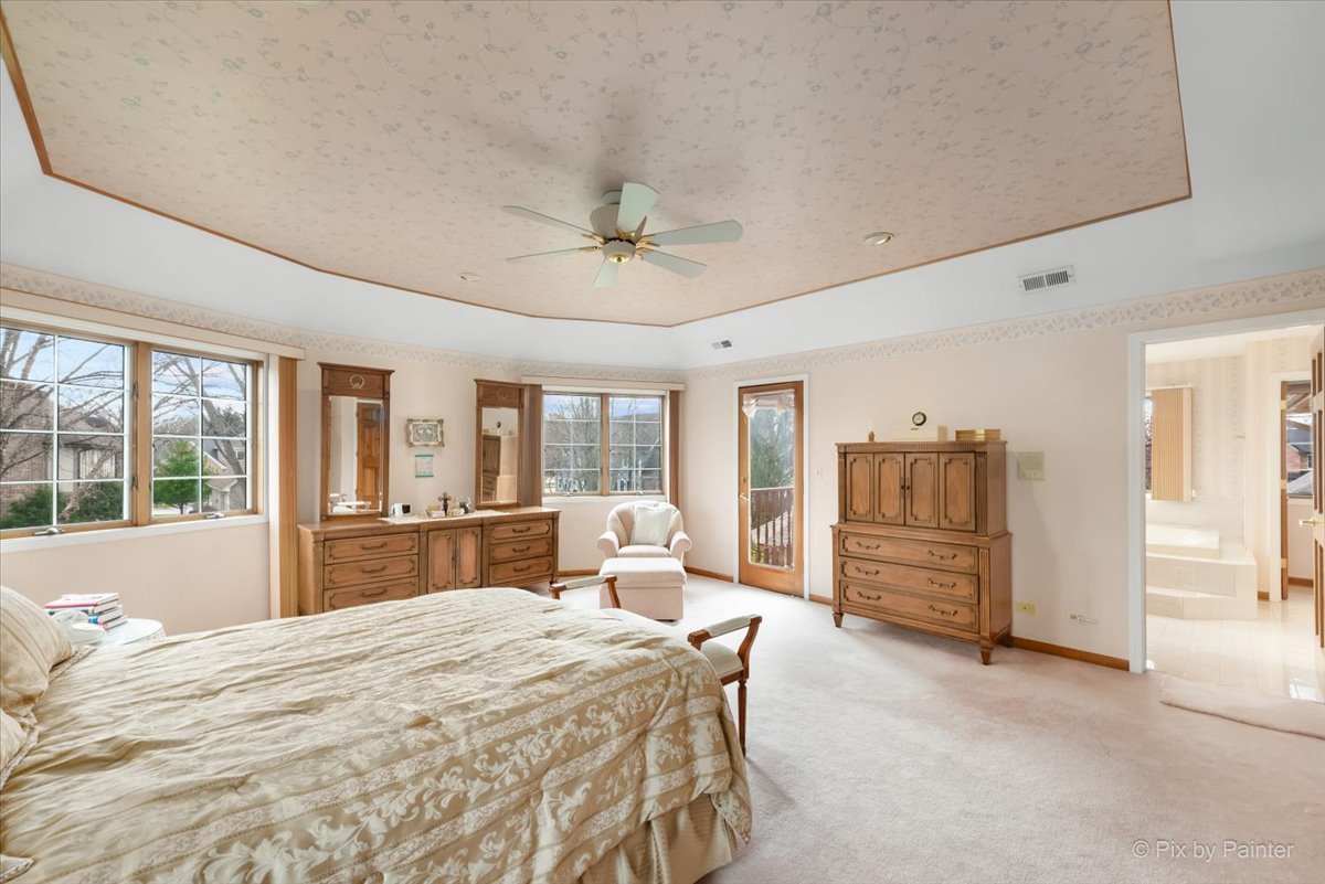 26W461 Churchill Road Winfield, IL 60190 - Photo 20 of 60 a bedroom with a large bed and large window