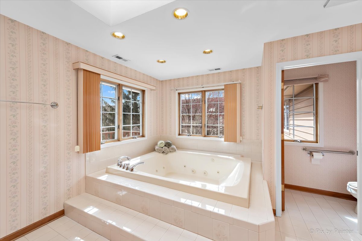 26W461 Churchill Road Winfield, IL 60190 - Photo 23 of 60 a white bath tub sitting next to a window