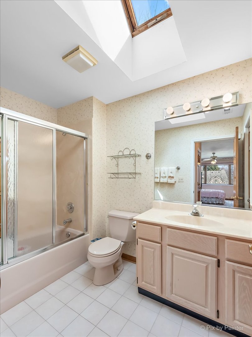 26W461 Churchill Road Winfield, IL 60190 - Photo 26 of 60 a spacious bathroom with a double vanity sink toilet and a tub