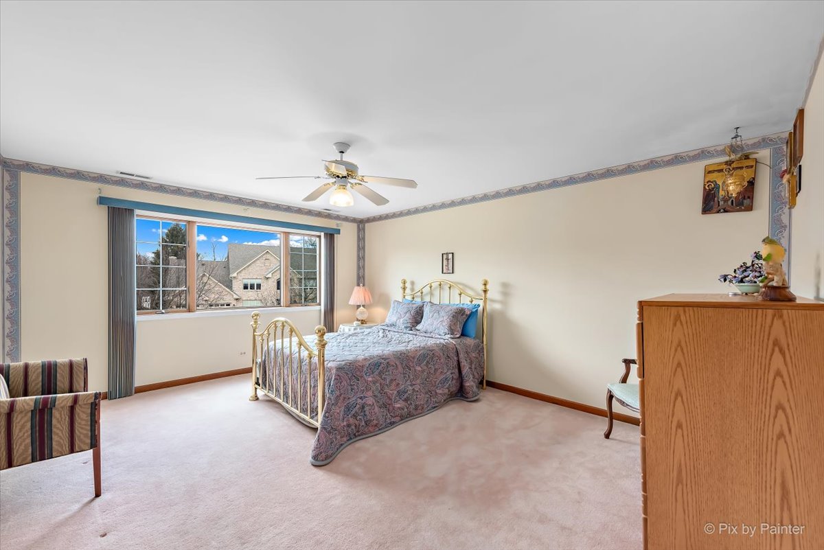 26W461 Churchill Road Winfield, IL 60190 - Photo 27 of 60 a living room with furniture and a chandelier