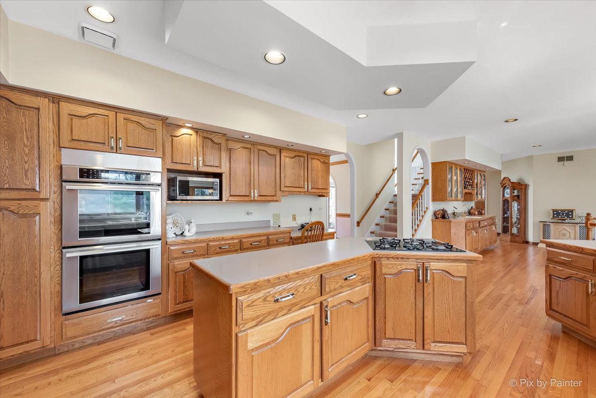 26W461 Churchill Road Winfield, IL 60190 - Photo 10 of 60 a kitchen with cabinets and stainless steel appliances