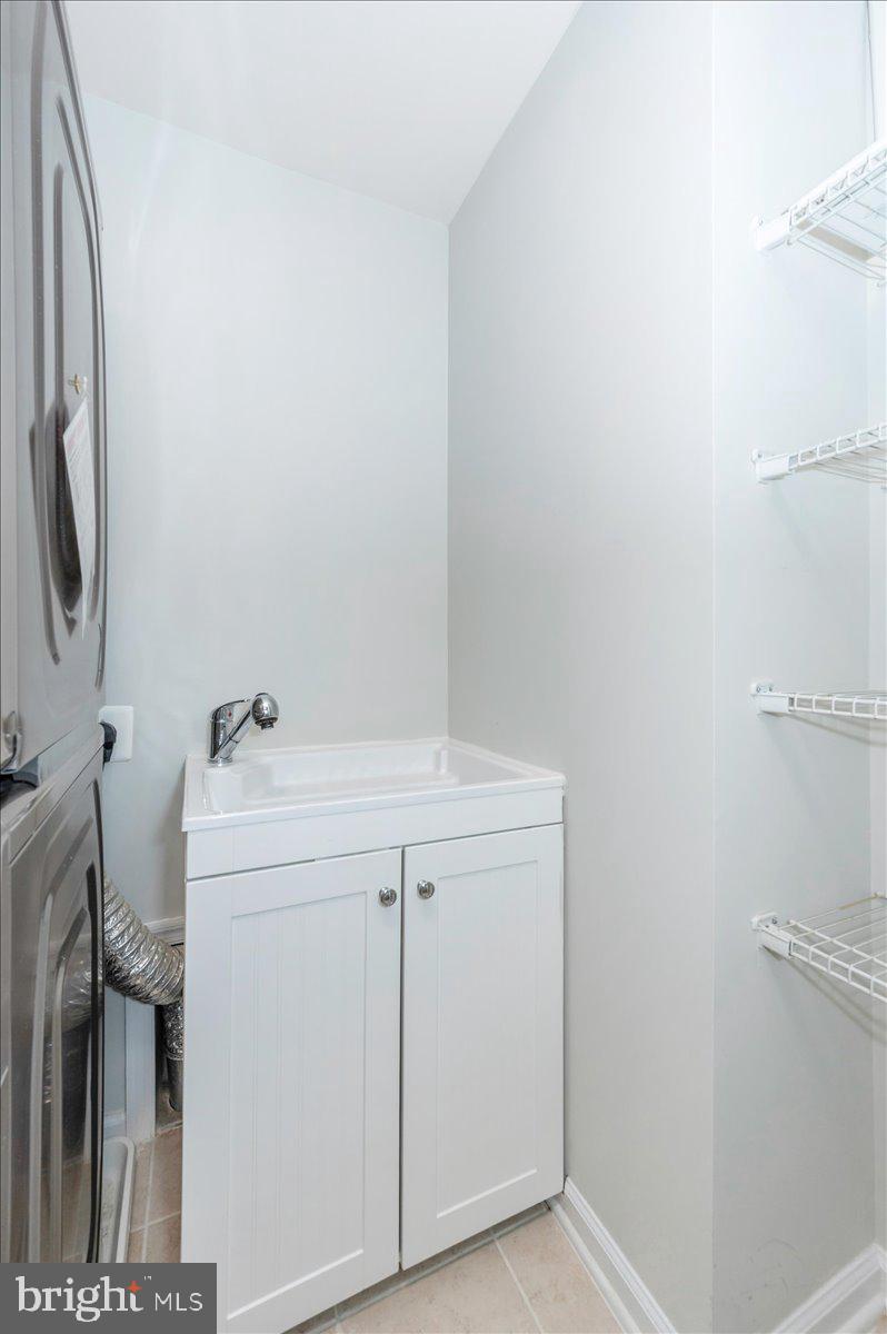 5059 Small Gains Way, Unit 5059 Frederick, MD 21703 - Photo 43 of 57 a utility room with dryer and washer