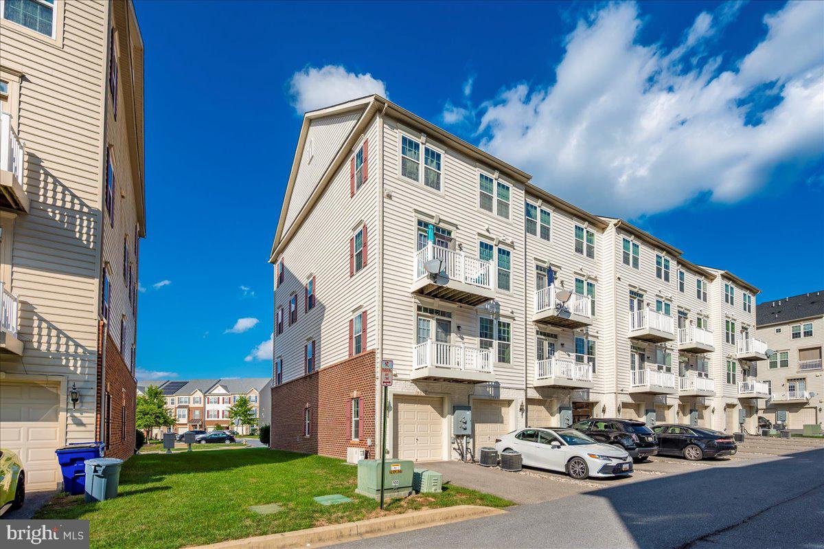 5059 Small Gains Way, Unit 5059 Frederick, MD 21703 - Photo 47 of 57 a front view of a building with street view